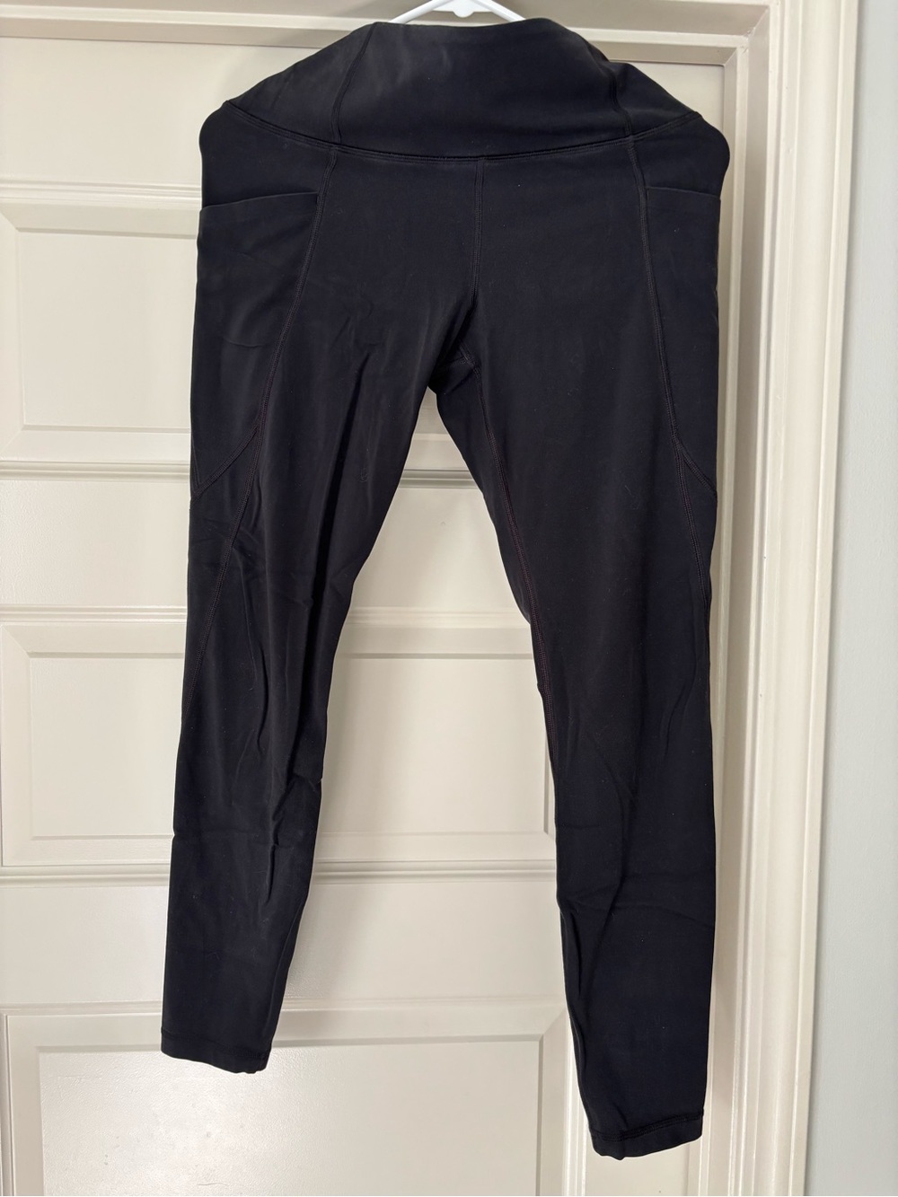 Athleta Black High-Waist Leggings with side pockets. 7/8 length.